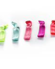 Brights - InStyler All Tied Up Hair Ties-Five ties in coral, watermelon, sky, hot pink and citron folded and lined up on white background