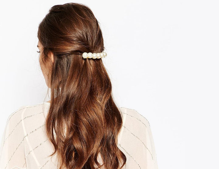pretty flowing long curled hair pulled back in barrett