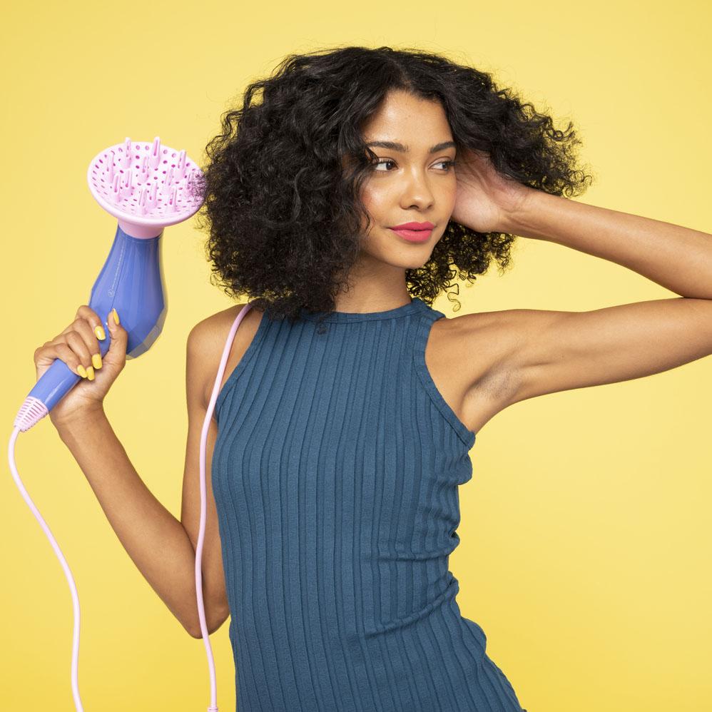 Woman holding up a Pro Dryer Diffuser