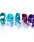 Vibrant - InStyler All Tied Up Hair Ties-Five ties in amethyst, aqua, turquoise, emerald and ruby. Laid on side on white background.