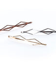 GeometricMetallics -  InStyler Geometric Pin It Up Bobby Pins-lifestyle photo of pins in gold, rose gold and gold metallic